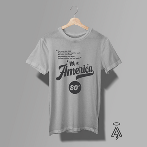 This bold, vintage-inspired heather gray tee pays tribute to Charlie Daniels Band’s 1980 anthem “In America” — the song that captured the grit and unshakable spirit of a nation determined to stand tall together.