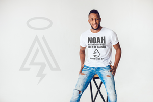 Person wearing a white t-shirt with 'NOAH' text "Luke 17:26-7" and blue jeans on a white background.