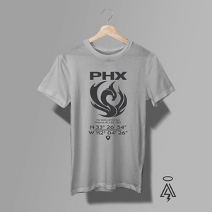 Rise with the city that never stops reinventing itself in the PHX – Valley of the Sun Tee — a bold tribute to Phoenix, Arizona’s grit, heat, and unstoppable energy. Front and center, a striking black phoenix spreads its wings in a powerful upward sweep, its feathers flowing into flame-like curves and sun rays.  