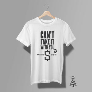 A white short-sleeve t-shirt. The shirt features a black graphic print with the text 'CAN'T TAKE IT WITH YOU', 'MATTHEW 6:18-20', a dollar sign, and '78°'.