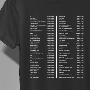 A close-up of a black T-shirt with a white printed list of Compton Terrace Concert list with dates, shown on a model against a dark background.