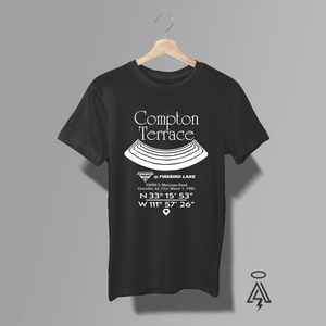 A black short-sleeve t-shirt ,The shirt features a white graphic print of a terraced lawn design with coordinates and the text 'Compton Terrace' and 'Firebird Lake'.
