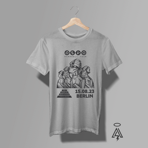 This Devo Farewell Tour – Berlin ’23 tee captures the spirit of one of new wave’s most influential and visually iconic bands.
The graphic features Devo’s legendary energy-dome–capped figures in a striking, monochrome illustration — instantly recognizable to fans.15.08.23 – Berlin, marking a final chapter moment from their farewell tour.