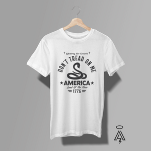 Rooted in one of America's most enduring symbols of freedom, this design pays tribute to the spirit of 1776 and the unwavering resolve of those who believed liberty was worth defending. Featuring the iconic coiled rattlesnake beneath the bold declaration "Don't Tread on Me," the artwork echoes the message of the historic Gadsden Flag—a symbol of vigilance, independence, and resistance to tyranny.