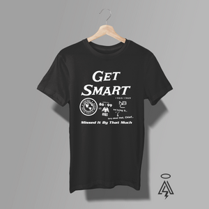 Sorry about that, Chief… this one’s a must-have. Step into the world of shoe phones, secret doors, and perfectly botched missions with this Get Smart tribute tee, celebrating the cult-classic spy comedy that defined smart, slapstick espionage from 1965–1969.