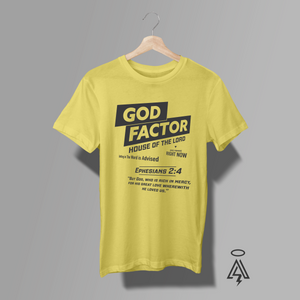 A yellow short-sleeve t-shirt. The shirt features a black graphic print with the text 'GOD FACTOR' and a Bible verse from Ephesians 2:4.
