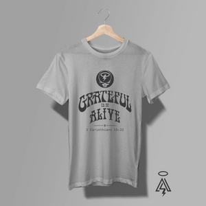 Heather Gray t-shirt with 'Grateful to be Alive' design a mockup of "Grateful Dead" and text with Corinthians 15:22.
