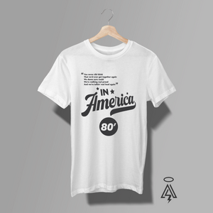 This bold, vintage-inspired white tee pays tribute to Charlie Daniels Band’s 1980 anthem “In America” — the song that captured the grit and unshakable spirit of a nation determined to stand tall together.