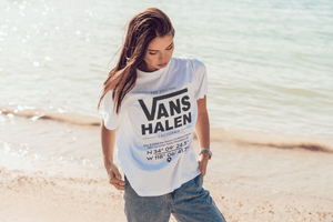 Person wearing a Vans Halen coordinates t-shirt on a beach