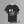 Black t-shirt with black graphic design with a Camel/Needle and the verse Matthew 19:24.